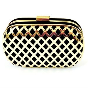 Express small hard case clutch black and gold bag